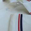 Chi tiết sản phẩm áo cổ trụ polo bo sọc cá sấu lạnh poly thấm hút màu trắng