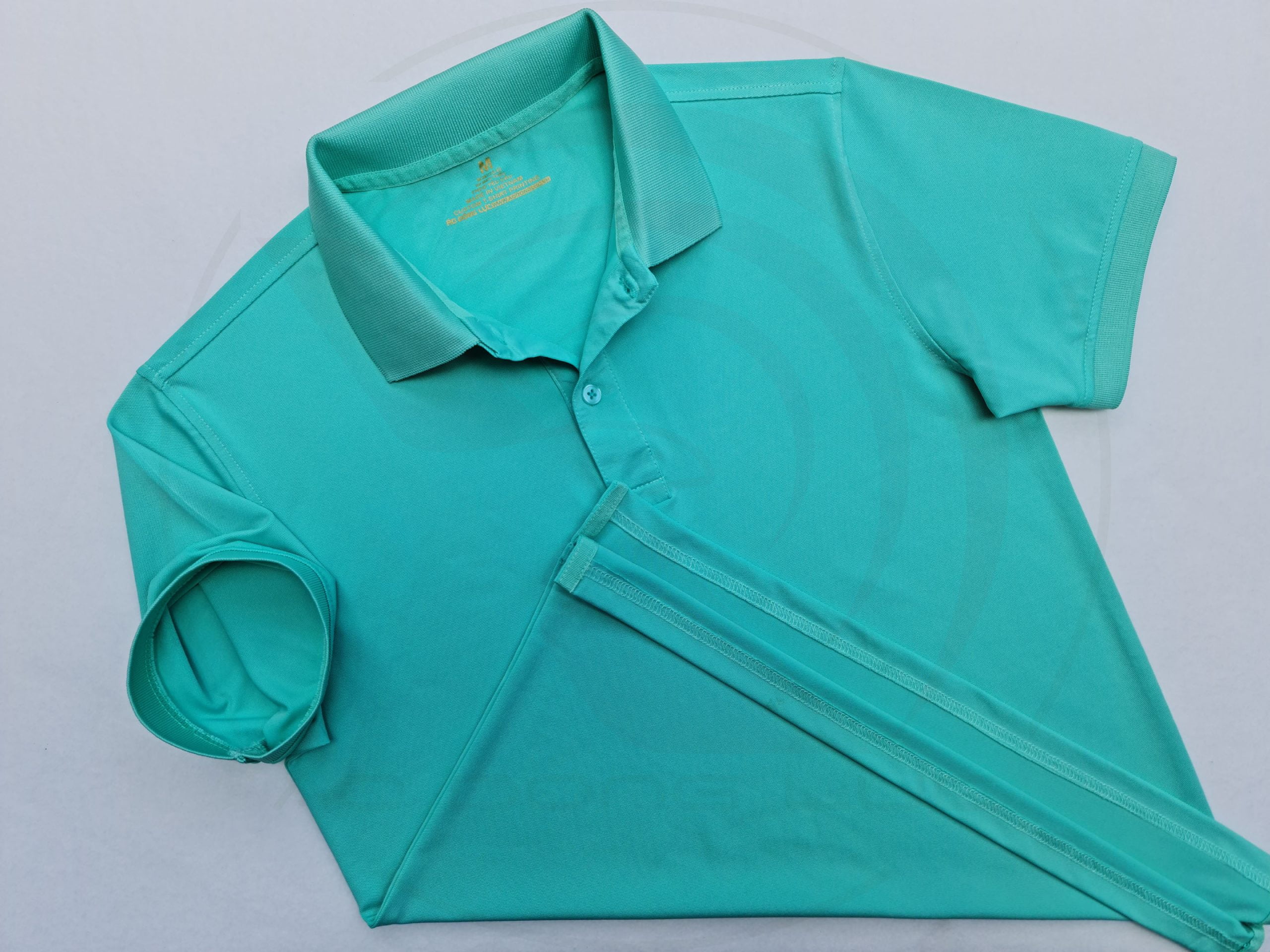 Áo thun cổ trụ polo bo trơn cá sấu lạnh poly thấm hút xanh ngọc