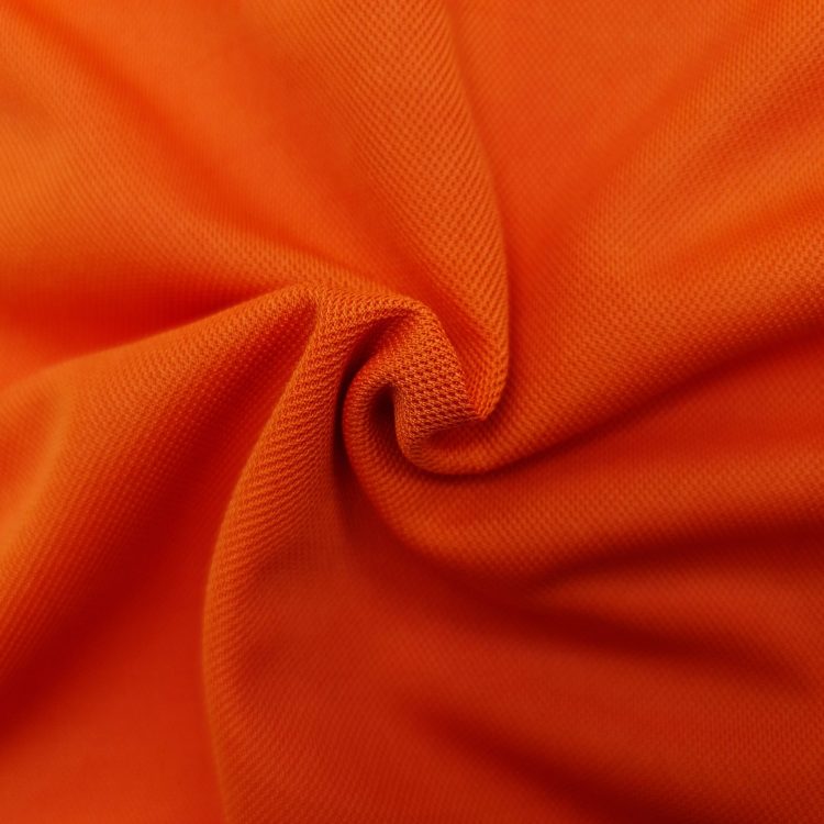 Hình chụp cận cảnh chất vải áo polo bo trơn cá sấu mè unisex màu cam