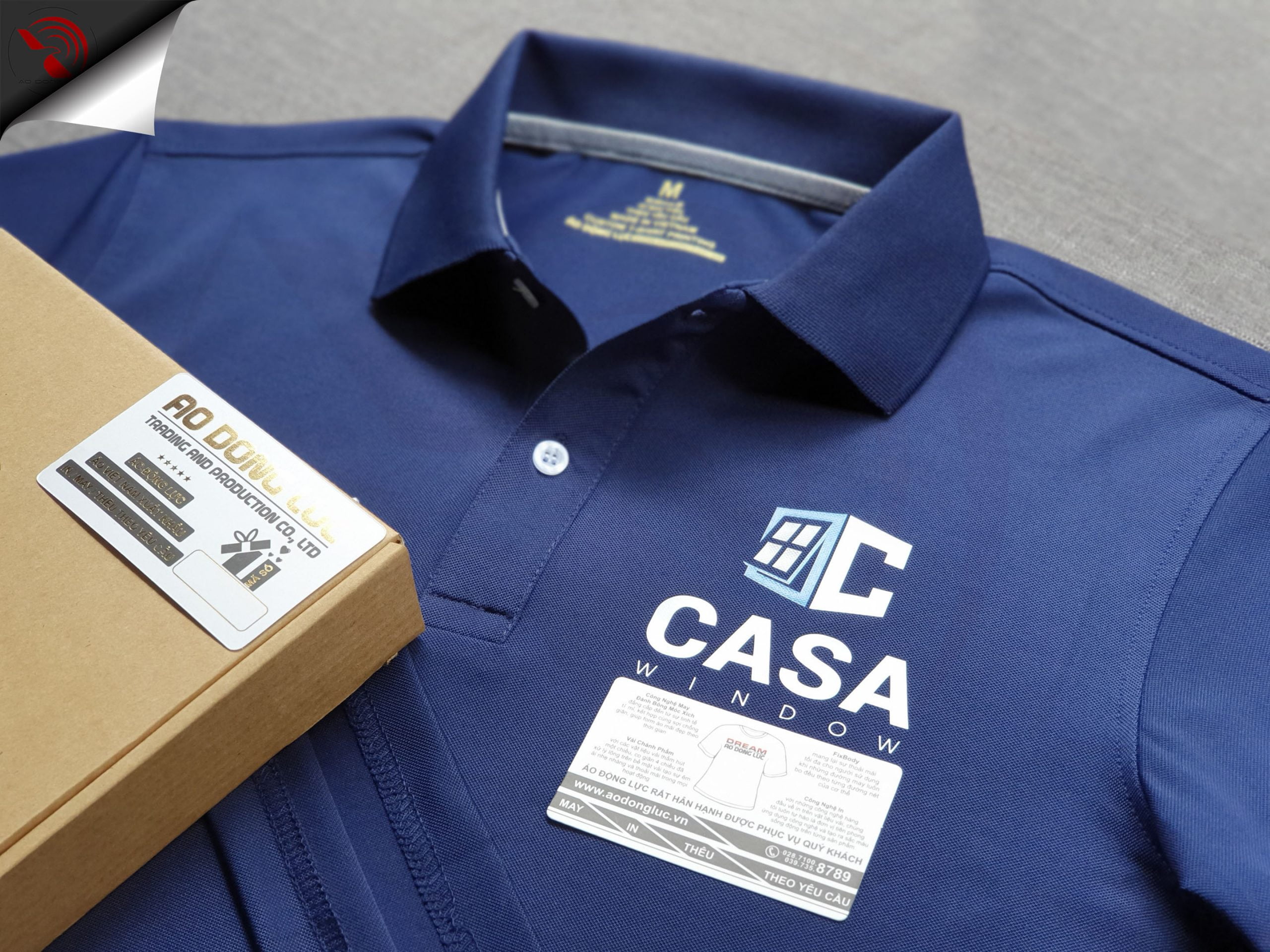 Đồng phục áo thun polo bo trơn xanh đen in decal logo
