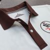 Đồng phục áo thun polo màu trắng phối bo tay bo cổ trụ cổ màu nâu in chuyển nhiệt