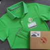 Đồng phục áo thun polo bo trơn màu xanh lá in decal logo