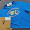 Đồng phục áo thun polo bo sọc màu xanh ya in decal logo