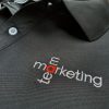 Hình thêu vi tính logo lên áo thun đồng phục polo bo trơn màu đen