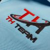 Hình thêu vi tính logo lên áo thun đồng phục polo bo sọc thiên thanh