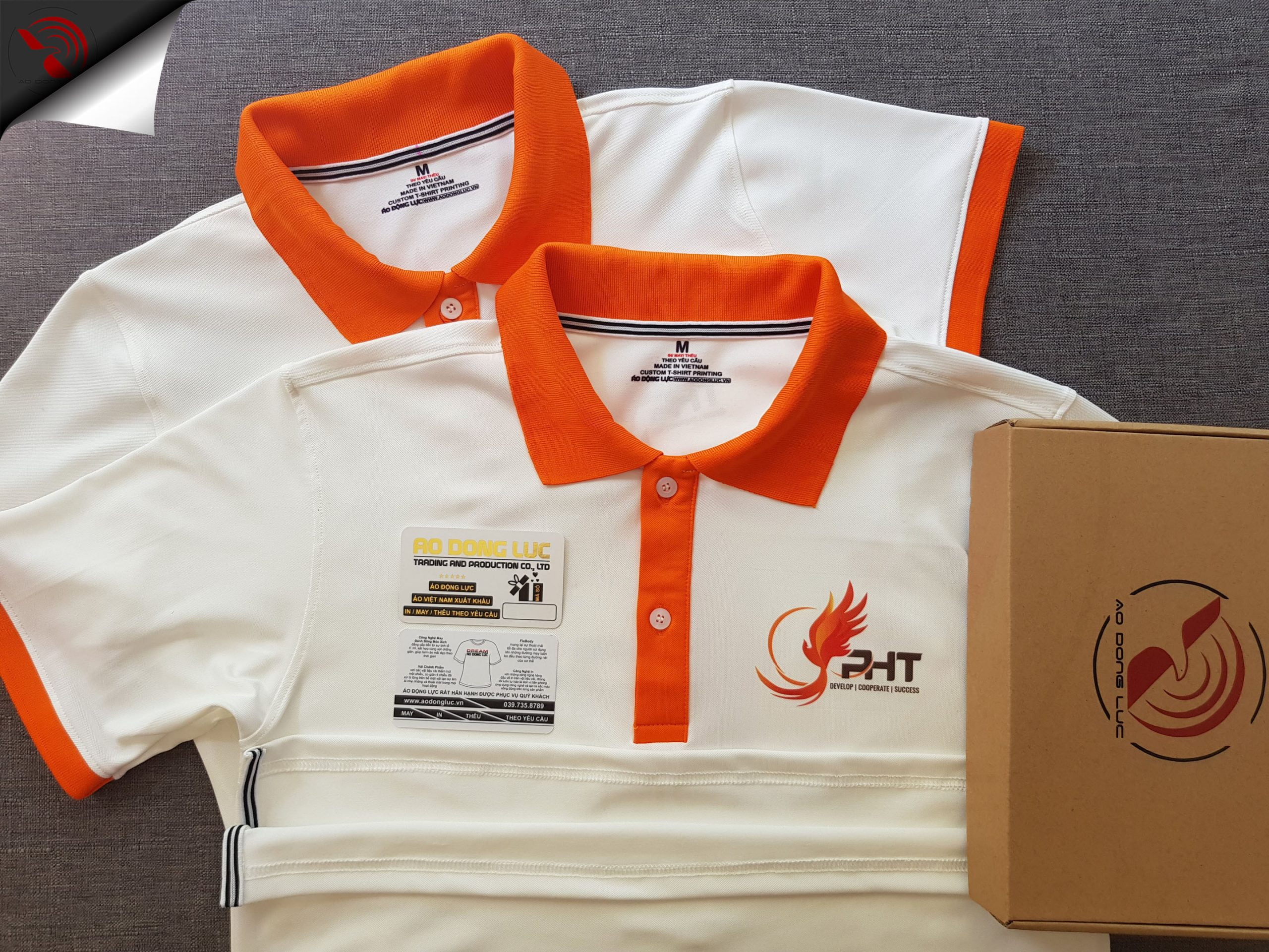 Đồng phục áo thun polo trắng phối cam in chuyển nhiệt