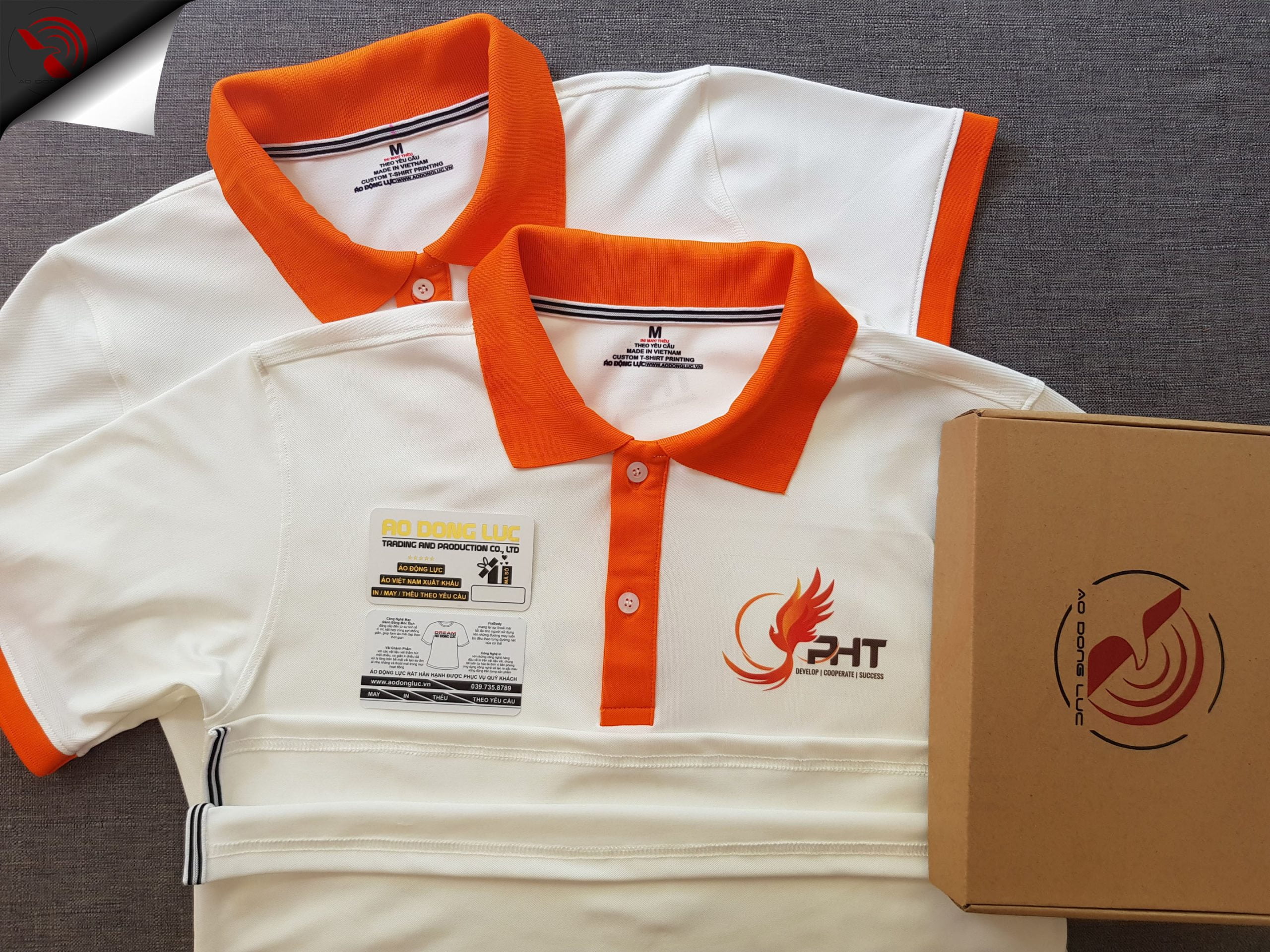 Đồng phục áo thun polo trắng phối cam in chuyển nhiệt